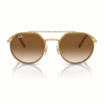 Lentes de sol Ray-Ban RB3765 001/51 en vista frontal, con montura metálica dorada, doble puente y cristales marrón degradado sobre fondo blanco.