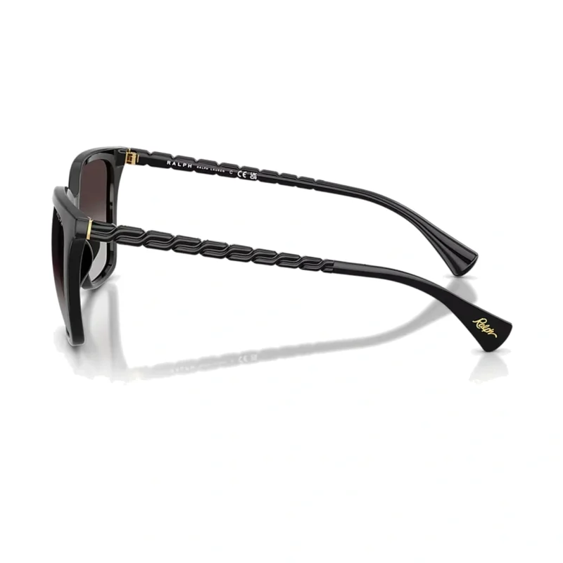 Ralph RA5328U 5001T3 con montura negro brillante y lentes gris degradado polarizado, vista diagonal sobre fondo blanco.